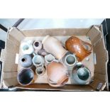 A large collection of studio ware jugs,