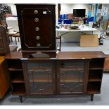 1930's slim sideboard with two glazed front doors between shelving and a similar mahogany chest of