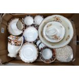 A collection of Sutherland floral decorated tea ware together with Woode Ivory ware large fruit