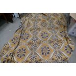A Tuftex Italian rug with a stylised design in yellow,