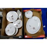 A collection of Royal Doulton Tumbling Leaves dinnerware to include dinner plates, serving platters,