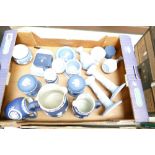 A collection of Wedgwood jasper ware in dark and light blue colouway to include candlesticks,