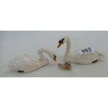 Two Beswick swans and cygnet