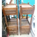 A pair of 20th century carved oak two tier side cabinets with barley twist front support columns