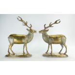 A Pair of brass mantlepiece figures of staggs,