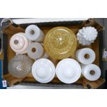 A collection of mid century glass lamp shades including milk glass items etc