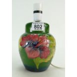 A small Moorcroft Hibiscus on green ground table lamp 16cm high.