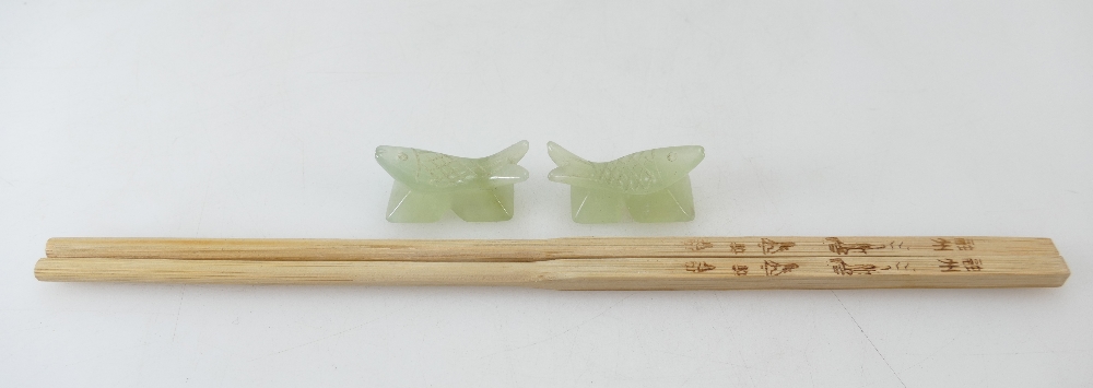 A pair of Chinese carved Jade chopstick rests.