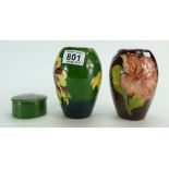 Moorcroft Hibiscus on green ground small vase 13cm high,