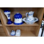 A collection of blue and white items to include modern water jug and bowl,