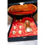 Cased gilded arabbic coffee set in black presentation box