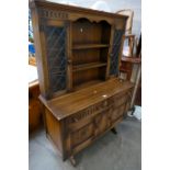20th Century oak priory style dresser sideboard with carved panels and leaded glazed doors