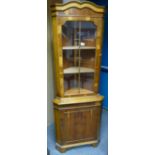 Reproduction walnut glaze fronted corner unit with double arched top