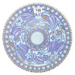 A Charlotte Rhead signed Crown Ducal charger with blue tulips.