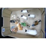 A collection of Beswick animals including small sheepdog,yorkshire terrier, sheep, lambs,