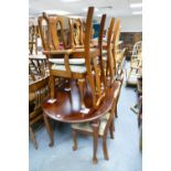 Queen Anne style extending dining table on cabriole legs,