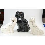 Pair of white Staffordshire dogs and larger black Staffordshire flat back dog