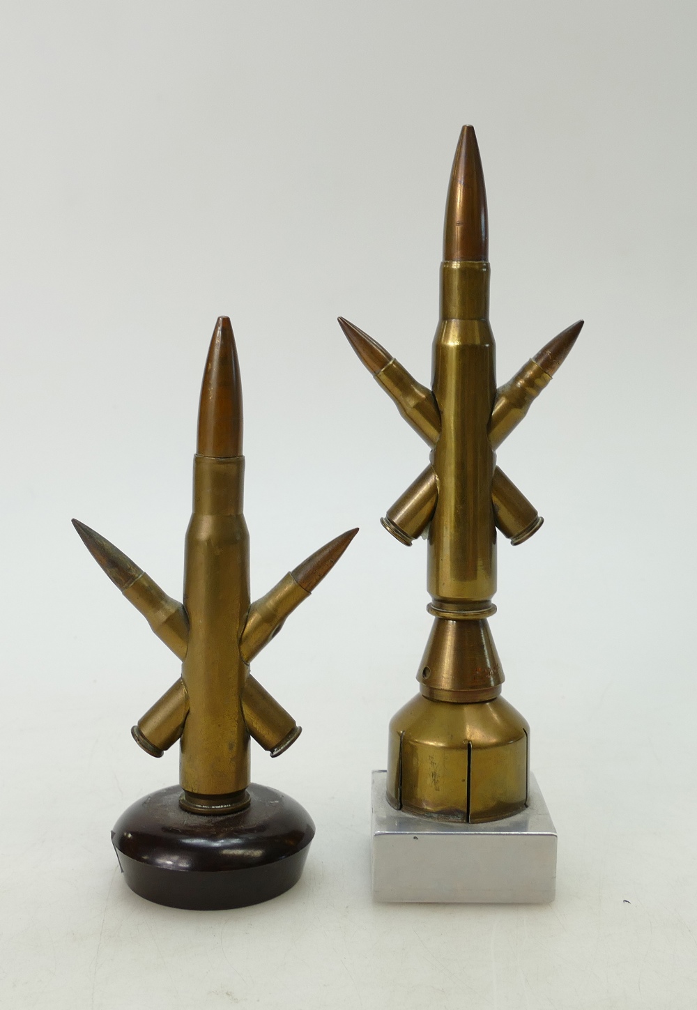Trench art .50 cal round with two .303 bullets both mounted on stands. One stamped Hill 62. 23cm.
