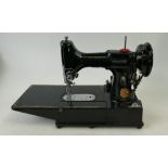 SINGER Sewing machine 222k with books, case, foot pedal and lots of original accessories.