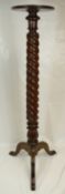Victorian carved mahogany twist torchere stand on carved tripod base
