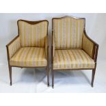 Two similar Edwardian inlaid mahogany armchairs,