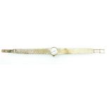 A ladies 9ct gold Omega wristwatch and 9ct bracelet, in ticking order. 26g.