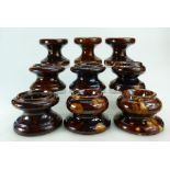 Group of 9 treacle glazed 19th century pottery FURNITURE RESTS all modelled as circular diablo