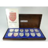 Set of 12 silver Medallions - THE ROYAL ARMS, each one hallmarked and with a COA,