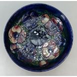 Large Moorcroft dish 27cm across, some slight scuffing to inside of bowl and light crazing to base.