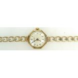 9ct gold ladies Vertex wristwatch in octagonal case, with 9ct bracelet, 14.