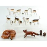 A collection of Beswick first and second version foxhounds,