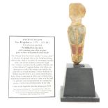 An ancient Egyptian new kingdom polychrome painted wooden uraeus on display stand with certificate