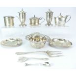 An assortment of Sterling silver - cruets, tea strainer, ashtrays and forks. Weighable silver 371.