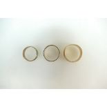 Three 9ct gold rings - wedding band 2.9g size N, band size O 3.