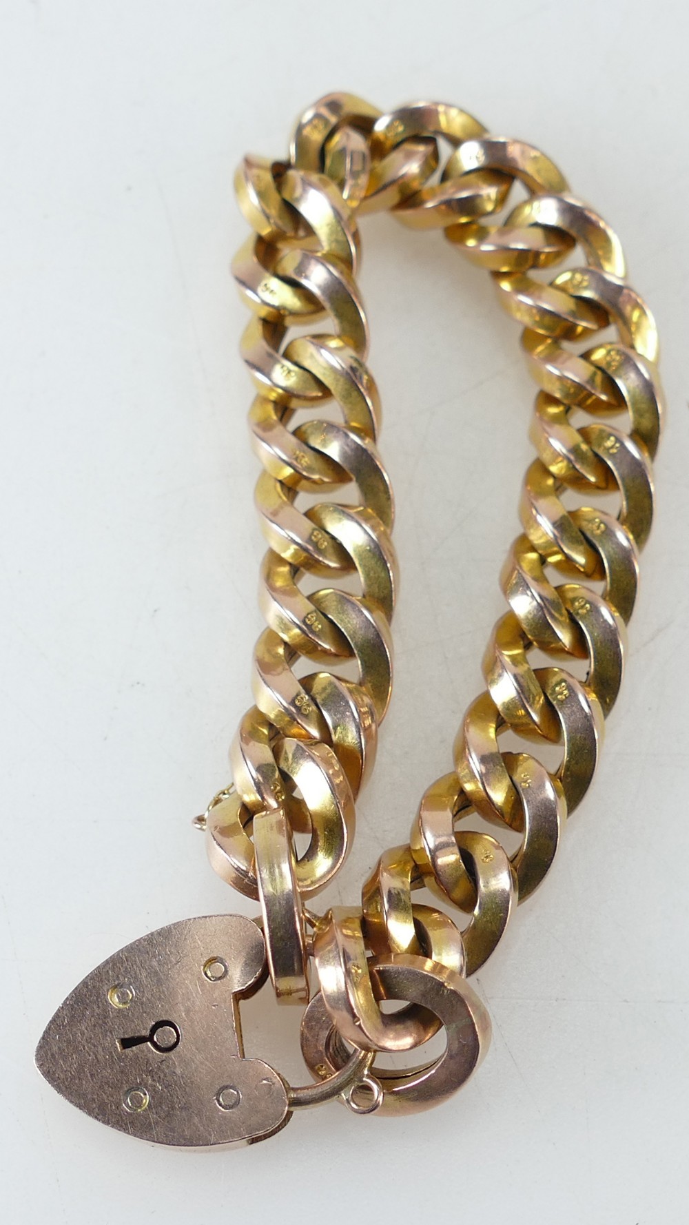 9ct gold bracelet - Early 20th century of hollow construction, 11mm square curb link, weight 27.1g.