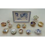 A collection of Royal Worcester pill boxes with various designs,