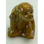Bernard Moore seated monkey, high fired in a mustard lustre glaze,