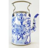 20th Century Chinese jug with floral blue and white decoration to body, brass handle and lid rim,