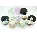 A collection of Shelley Chintz cups and saucers in various designs including Marguerite,