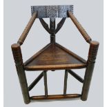 Carved and turned oak three legged spindle chair c1870-1900 in the 16th/17th century style, 85cm.