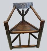 Carved and turned oak three legged spindle chair c1870-1900 in the 16th/17th century style, 85cm.