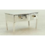 Silver novelty stamp holder in the form of a miniature table with lift up lid revealing 2 stamp