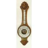 Carved Oak framed Aneroid barometer,