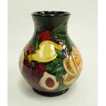 Moorcroft Figgy Pudding vase signed by designer Emma Bossons. Numbered Edition 4. Height 15cm.