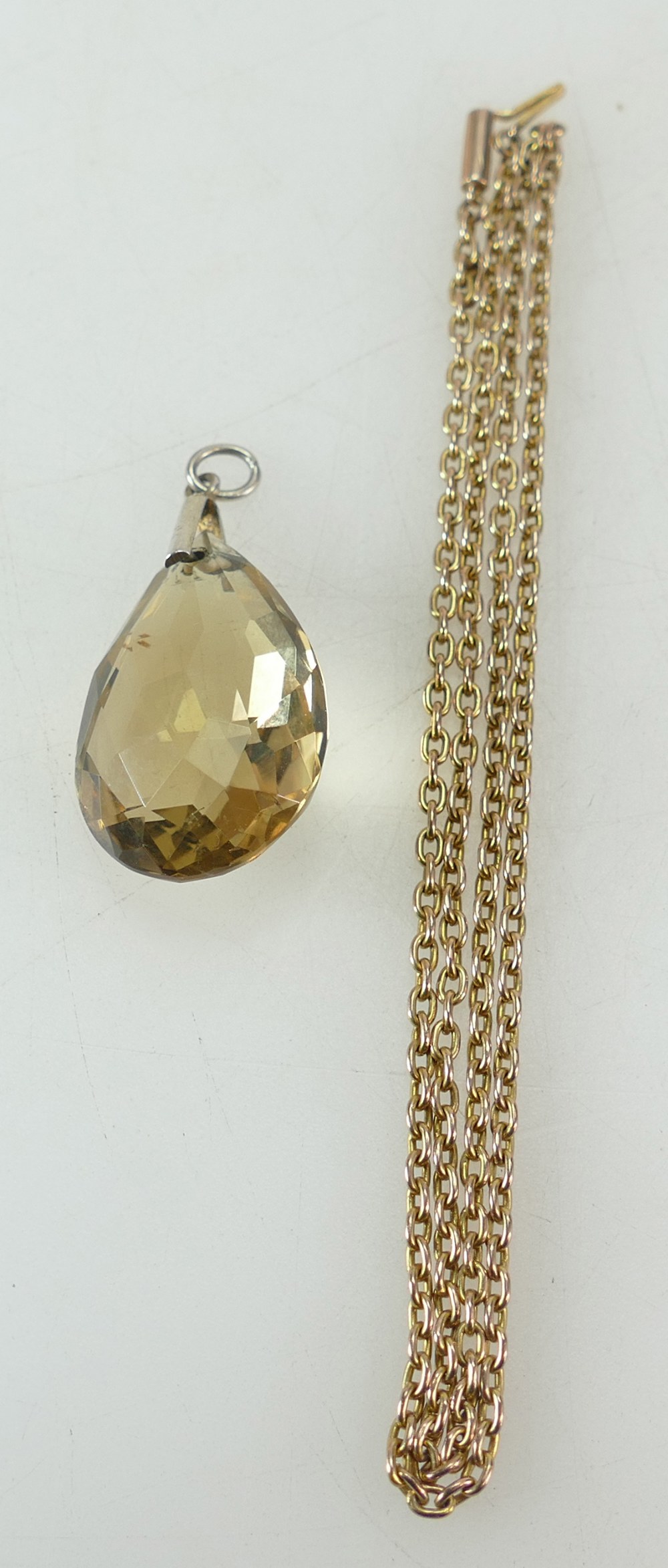 9ct gold chain 6.2g, together with large cut stone of unknown type, with silver gilt mounting.