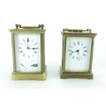 Two brass carriage clocks - one with subsidiary dials for day and date, hand replaced,