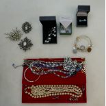 A collection of jewellery including silver earrings,