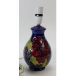 A Moorcroft Hibicus on blue ground small lamp base.