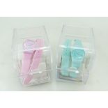 Ladies pink Swatch watch in case, Swatch Skeleton watch and another mint green example,