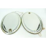 Decorative pair of oval antique fancy bevelled and circular cut mirrors,